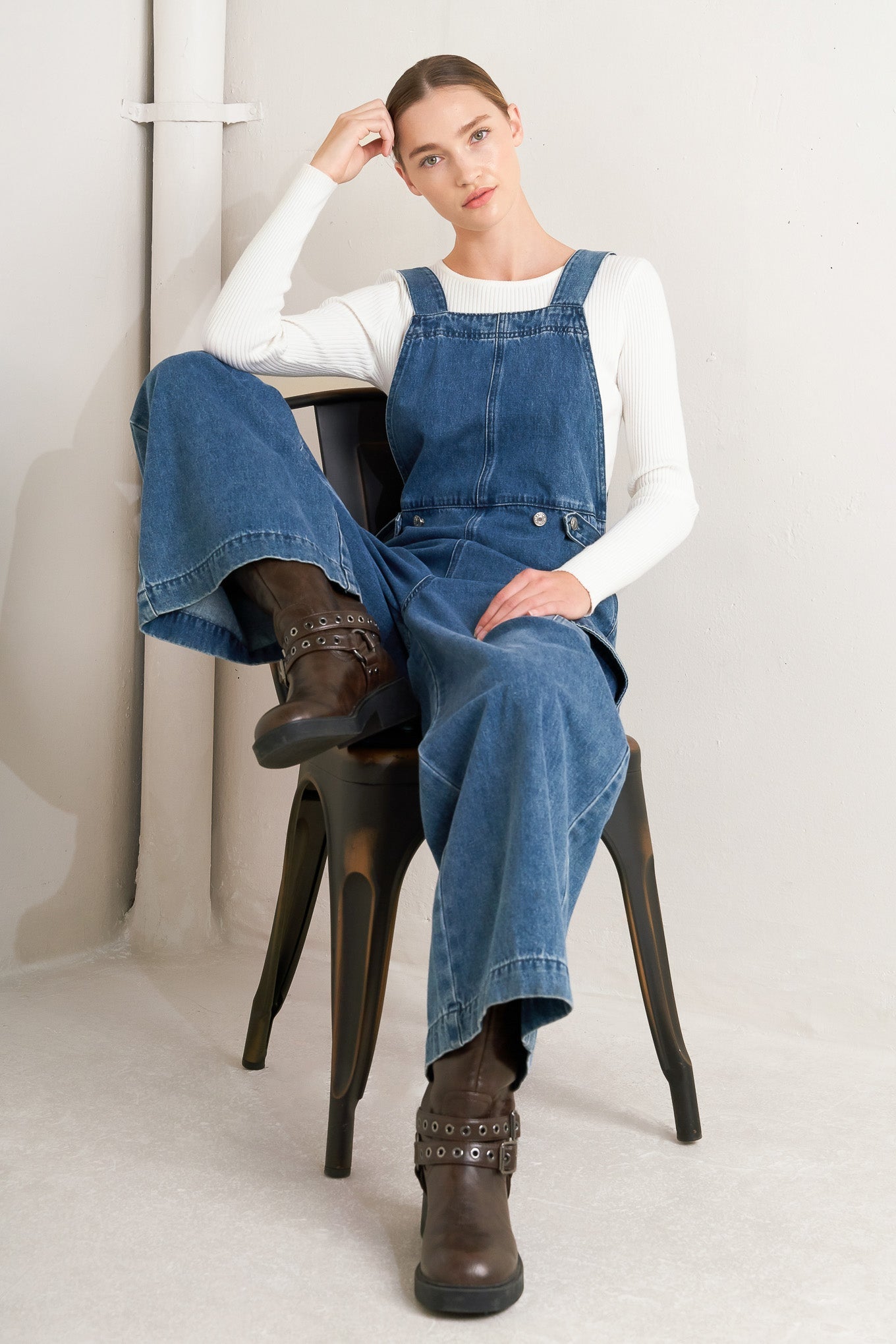 Denim overall outfit styled for a comfortable airport travel day