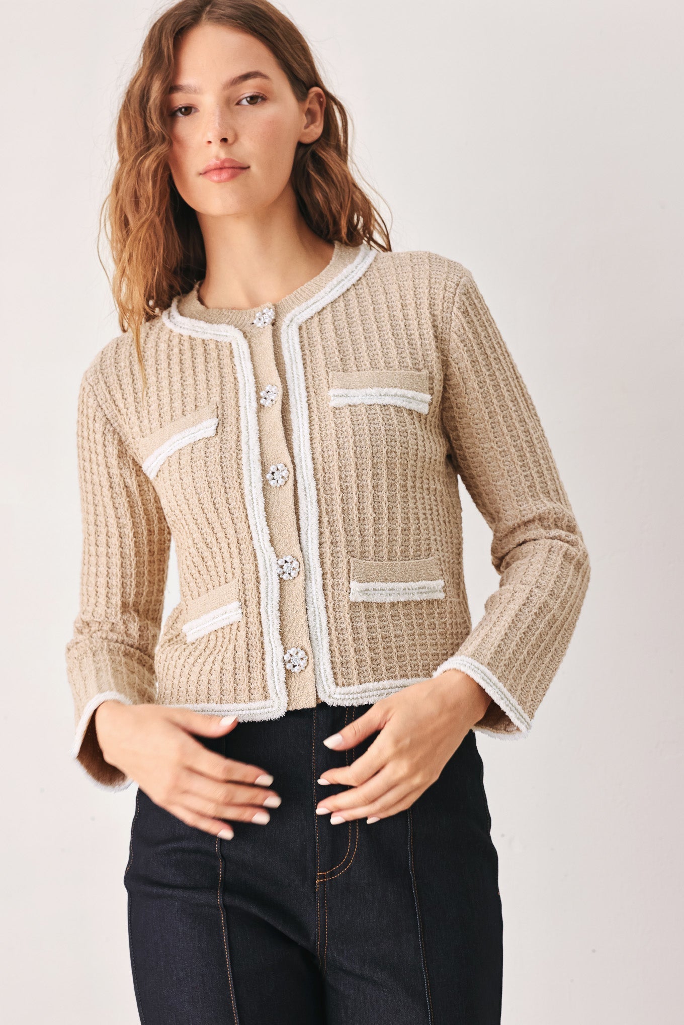 Camel and white cardigan styled for women over 50