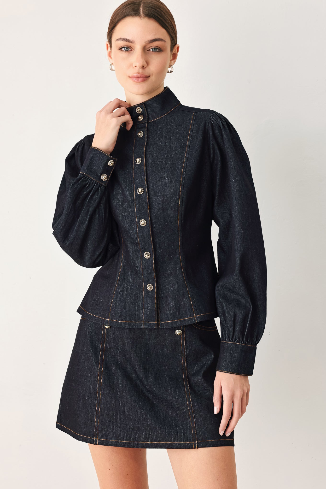Dark denim top styled for a polished casual outfit