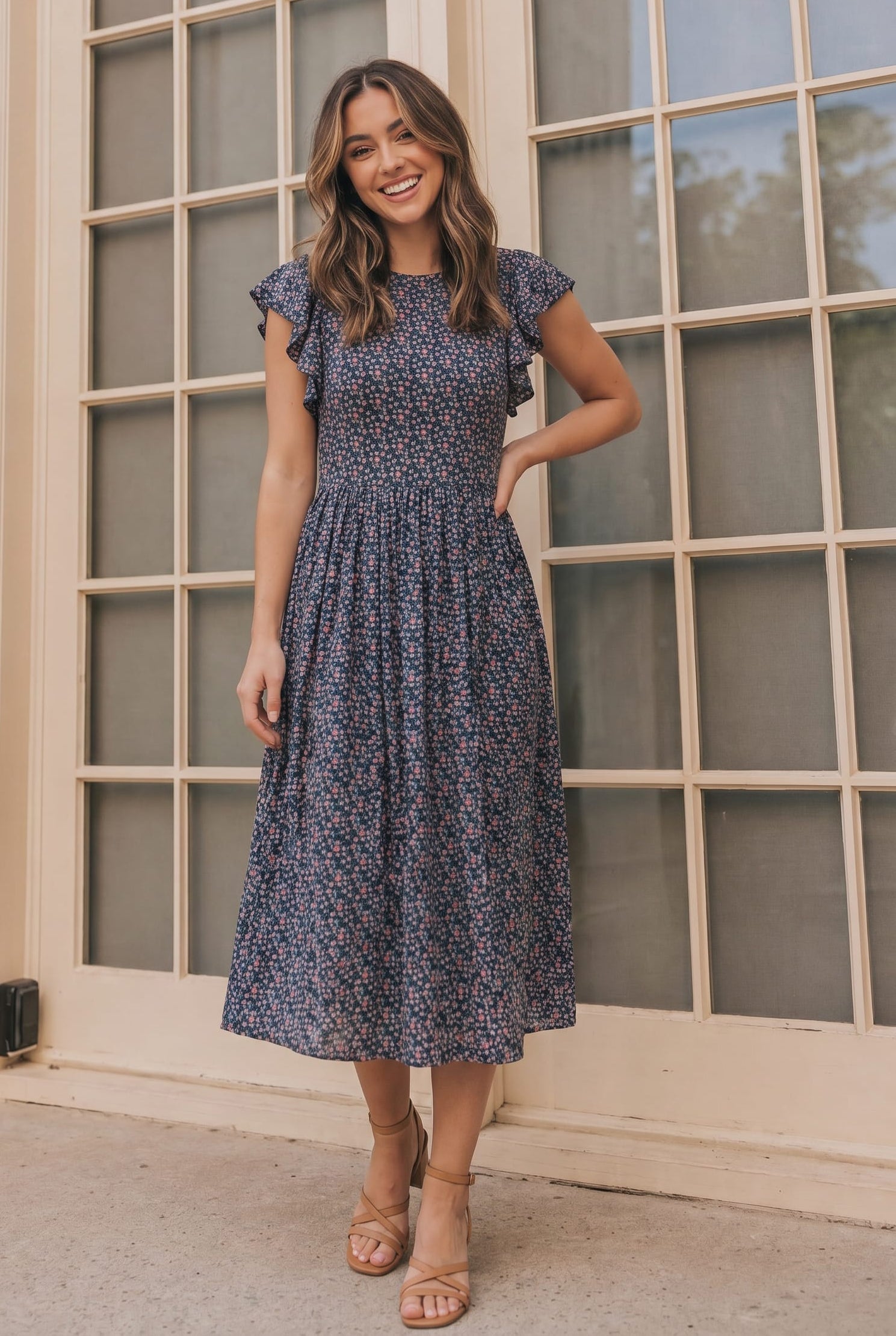 Black floral midi dress for a winter wedding guest outfit