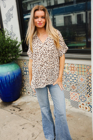 Best In Bold Ivory Animal Print V Neck Dolman Side Slit Top