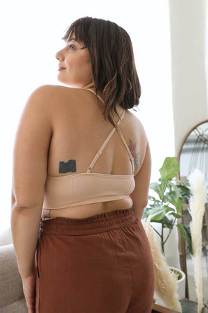 High neck crochet blush bralette with decorative cross-back straps.