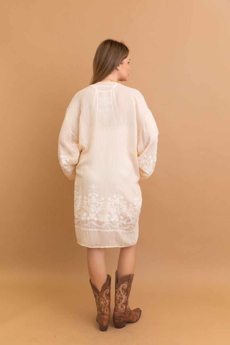 Blossom Breeze embroidered cream kimono with floral design.
