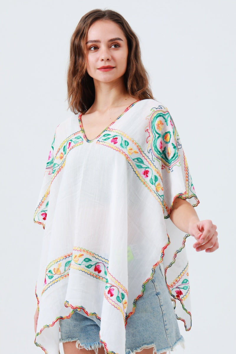 White floral embroidered kimono styled as a lightweight spring and summer layer