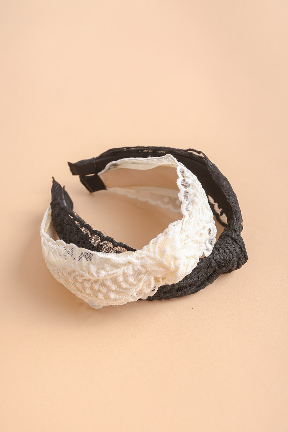 Embroidered floral vine knot headband with stylish and durable design.