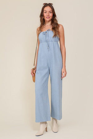 DENIM BLUE SLEEVELESS JUMPSUIT WITH SELF FRONT TIE Lumiere Denim Blue S 